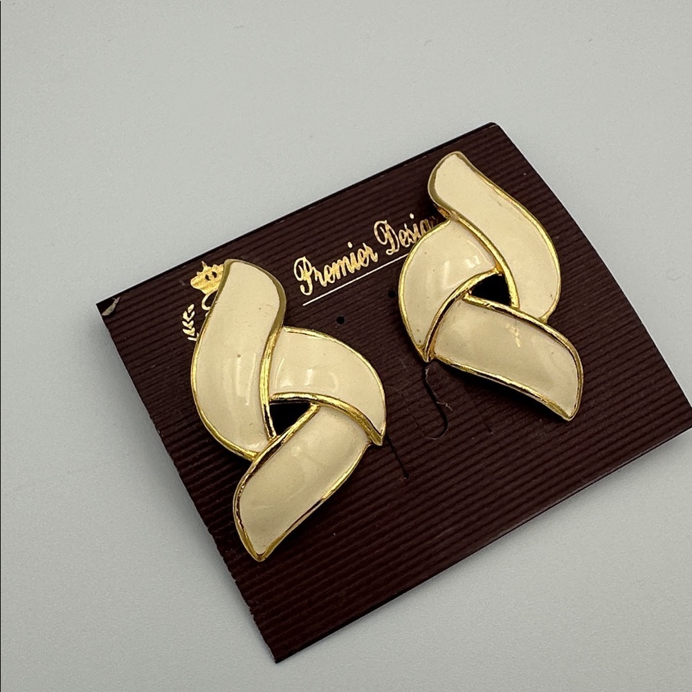 Premier Designs large cream white enamel and gold-tone clip-on earrings